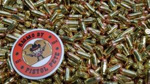 Loose remanufactured pistol ammo pile with a sticker that says Ammo by Pistol Pete and has a character holding two guns in the air.