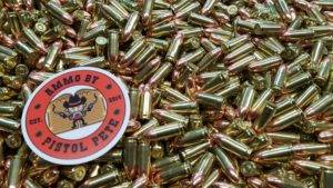 Loose pistol ammo pile with a sticker that says Ammo by Pistol Pete and has a character holding two guns in the air.